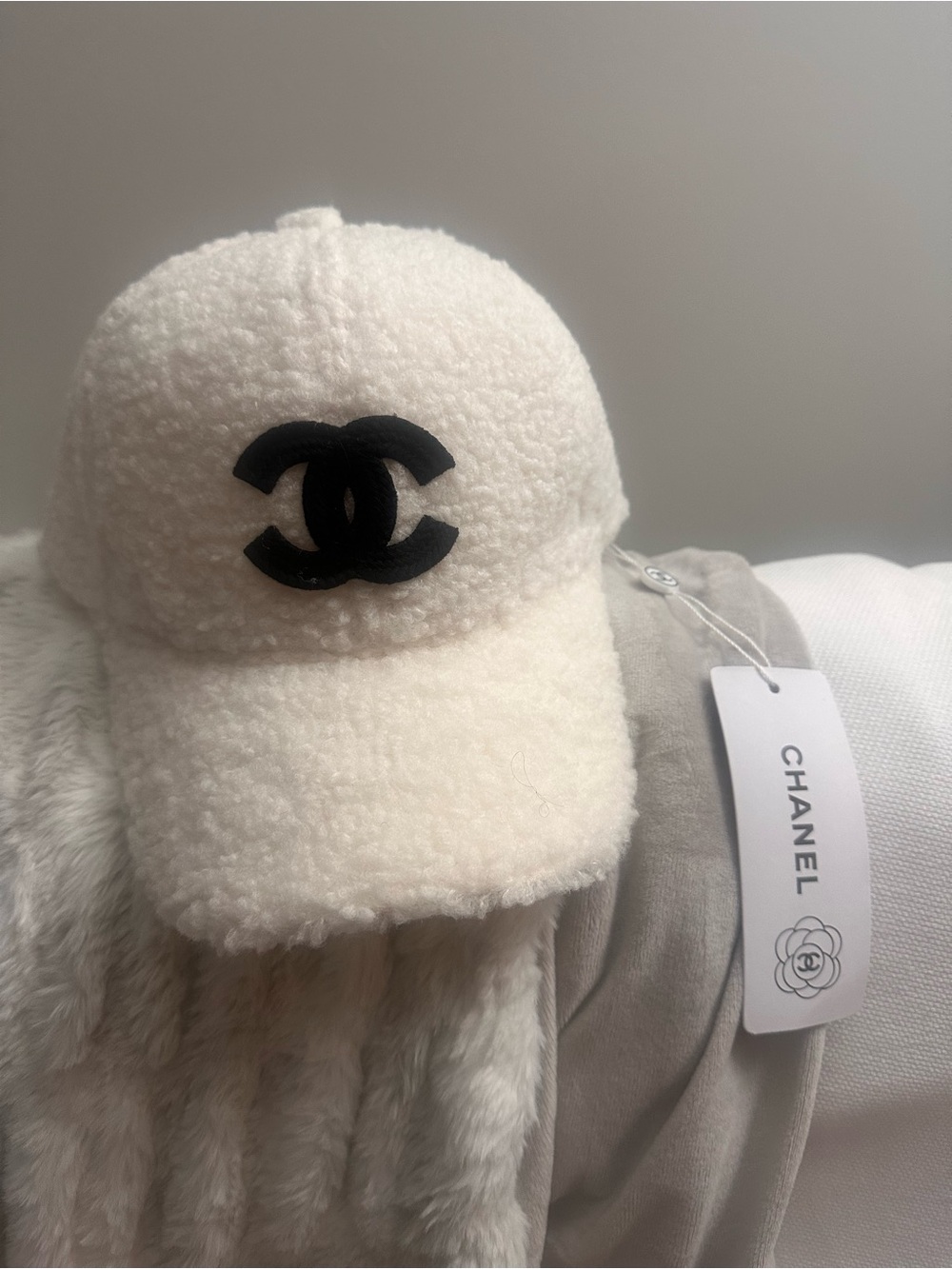 CHANEL Cream Teddy Baseball Cap with Black Logo Accent